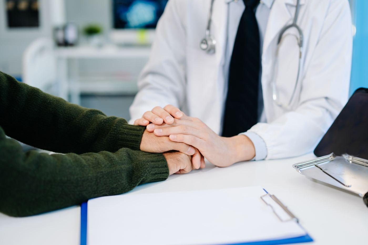 Physician consulting with a patient